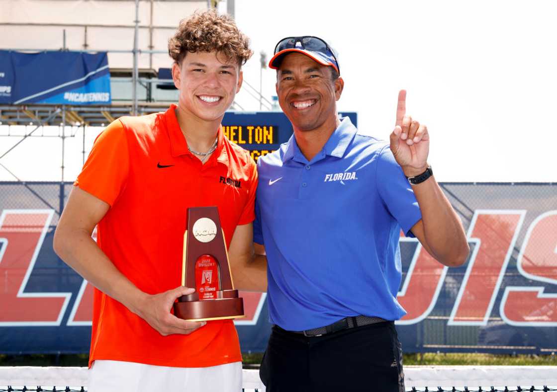 Floridas Ben Shelton celebrates with his father & coach Bryan Shelton at the Khan Outdoor Tennis Complex in Champaign, Illinois Floridas Ben Shelton celebrates with his father & coach Bryan Shelton at the Khan Outdoor Tennis Complex in Champaign, Illinois
