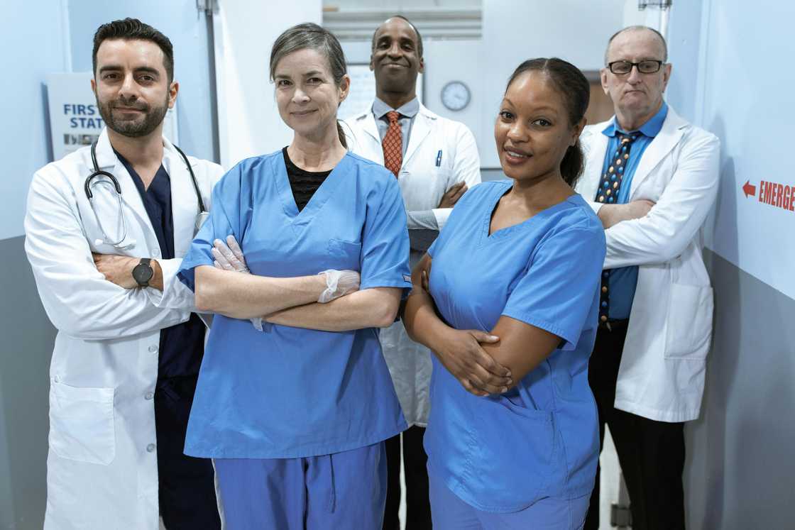 A team of medics standing together inside a hospital A team of medics standing together inside a hospital