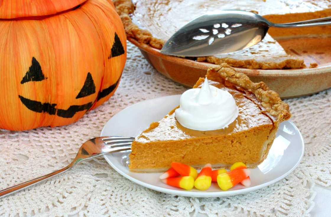 One slice of pumpkin pie with Halloween decorations. One slice of pumpkin pie with Halloween decorations.