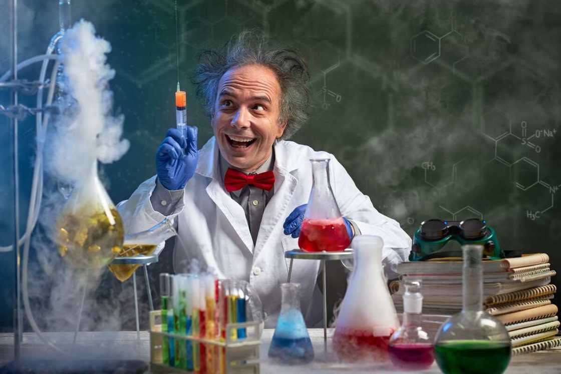 A mad scientist uses a hypodermic needle during an experiment to improve a golf ball. A mad scientist uses a hypodermic needle during an experiment to improve a golf ball.